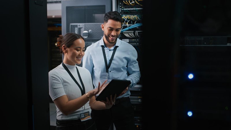 Two employees are discussing