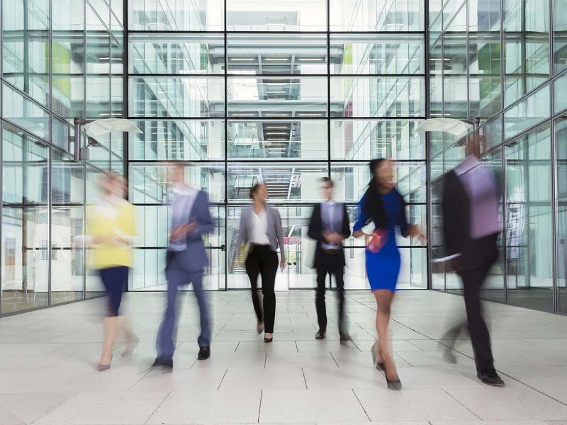 People walking inside the office building
