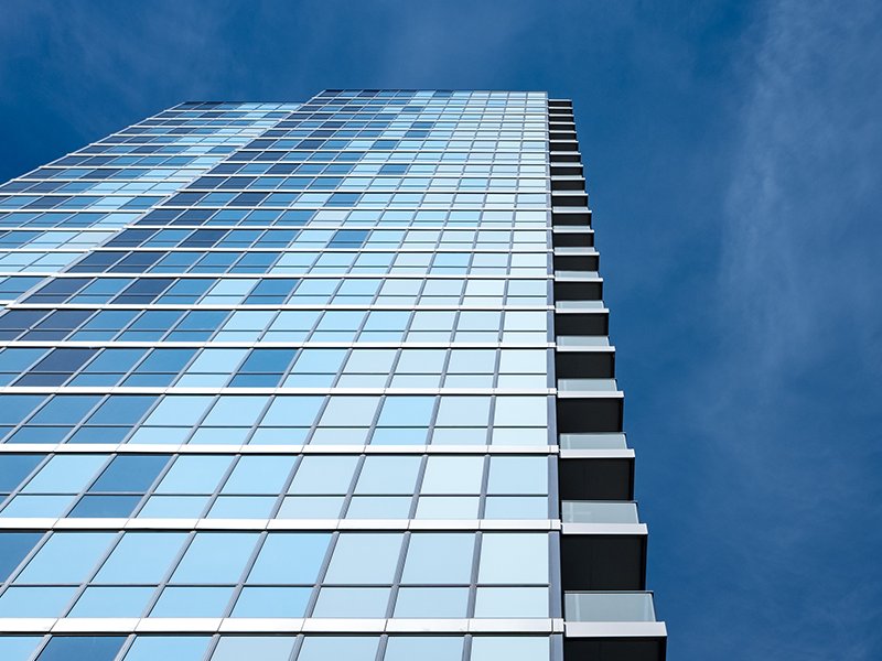 High rise building with blue mirrors