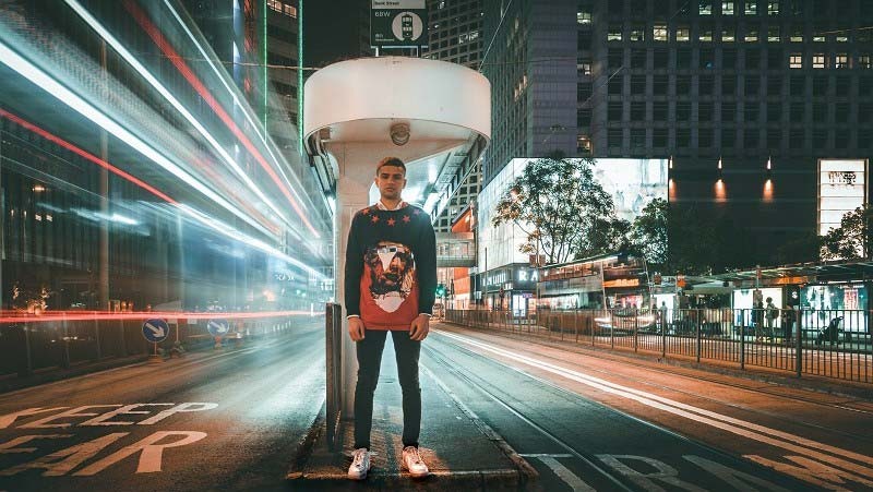 Time lapse shot of a man standing in centre of road 