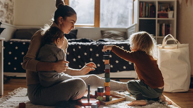 lady playing with her kids