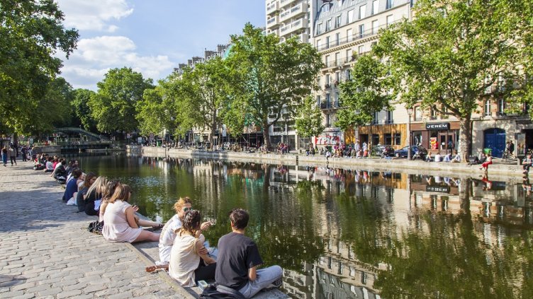 PARIS, FRANCE, on JULY 6, 2016. Saint Martin channel (fr. canal Saint-Martin). Embankments and their reflection in water