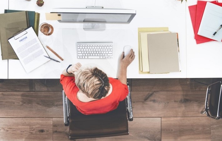 Top view shot of a man working on a desktop