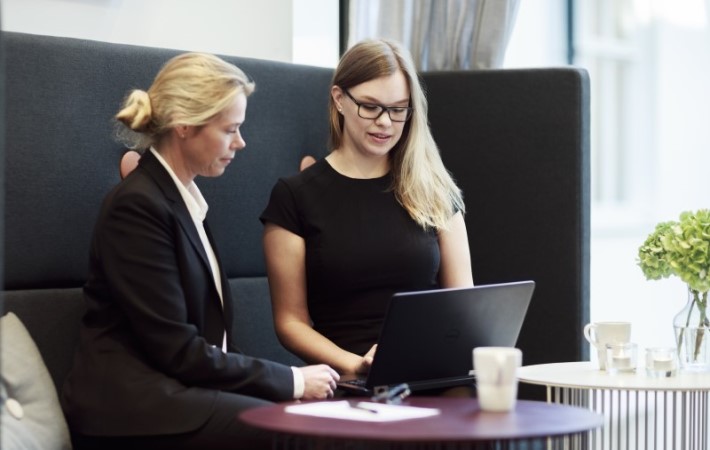 Female employee discussing the project with client