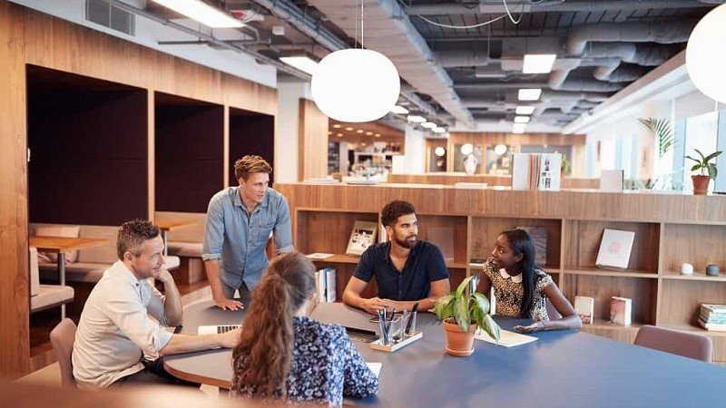 Employees discussing and working in premium office space