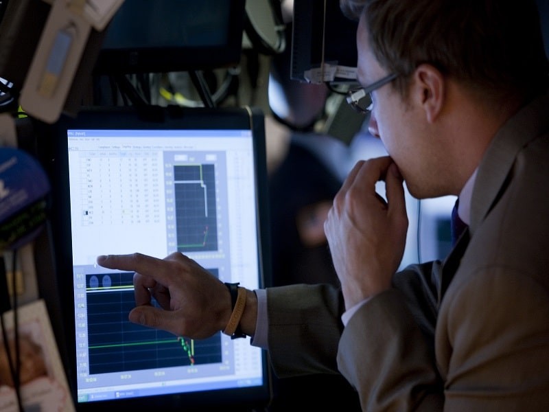 Data center technician analyzing and monitor the data in the computer screen.