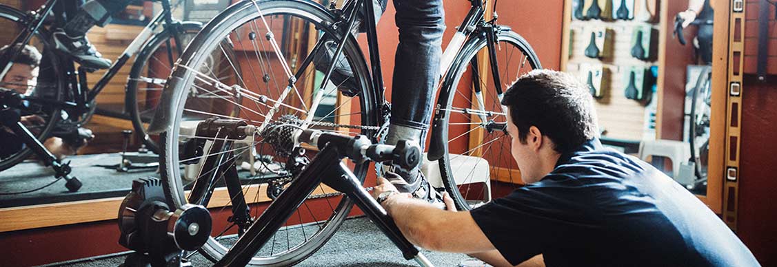 People doing excercise on cycle in a gym