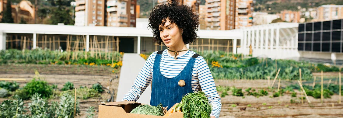 A woman holding a vegetable basket