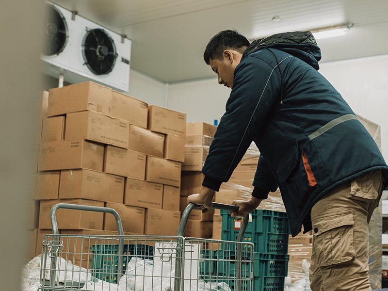 A man pushing the trolley