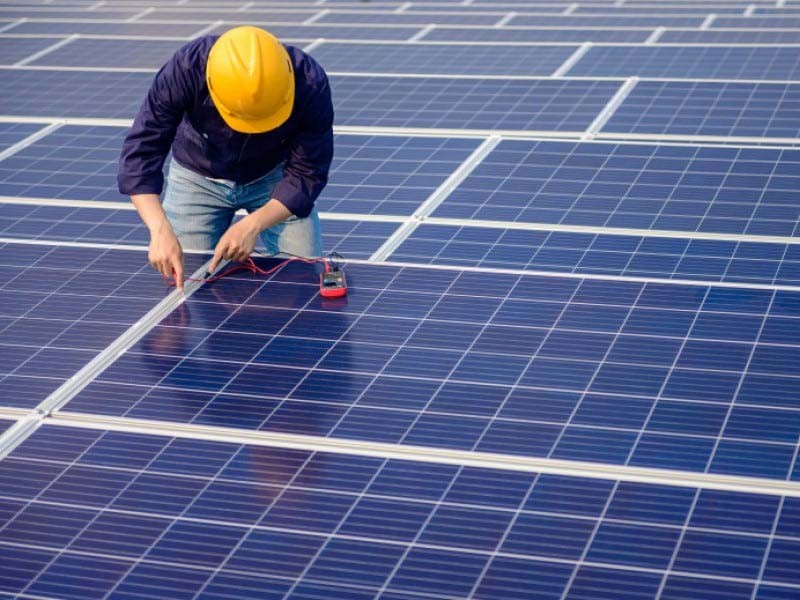 Guy working on renewable energy product solar panel
